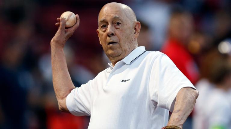 ESPN co-founder Bill Rasmussen tosses a ball before a baseball game between the Boston Red Sox and the New York Yankees in Boston, Sept. 8, 2019. (AP Photo / Michael Dwyer, File)