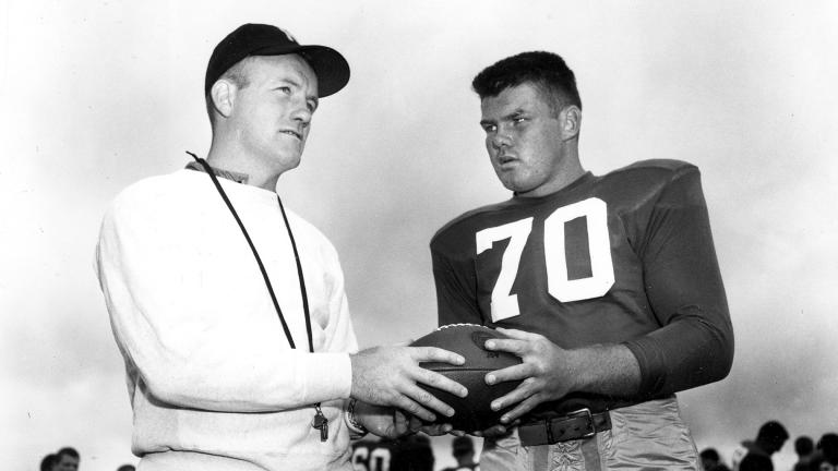 In this September 1958 file photo, Notre Dame football coach Terry Brennan, left, talks with tackle Bronko Nagurski Jr. during practice in South Bend, Ind. (AP Photo, File)