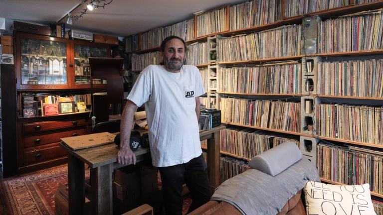Aadam Jacobs poses in front of LP (long play) record storage bookcase at his home in Chicago, Thursday, March 19, 2026. (AP Photo / Nam Y. Huh)