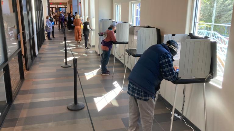 Santa Fe County, N.M., residents fill out general election ballots during the first day of general election voting, Oct. 11, 2022, in a hallway outside the Santa Fe County Clerk's Office in Santa Fe, N.M. (AP Photo / Morgan Lee, File)