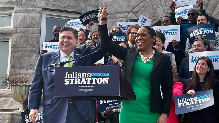 Gov. J.B. Pritzker, left, celebrates with Lt. Gov. Juliana Stratton, right, after announcing he will endorse his governing partner in the 2026 Democratic primary for one of Illinois’ U.S. Senate seats. Pritzker on Friday, April 25, 2025, announced his endorsement outside a church in Stratton’s Bronzeville neighborhood on Chicago’s South Side. (Hannah Meisel / Capitol News Illinois)