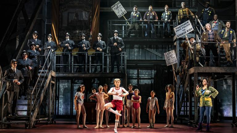 Michelle Aravena, right, plays Mrs. Wilkinson, the ballet teacher of Billy, played by Neo Del Corral, center, in “Billy Elliot: The Musical” at Paramount Theatre in Aurora. (Credit: Liz Lauren)
