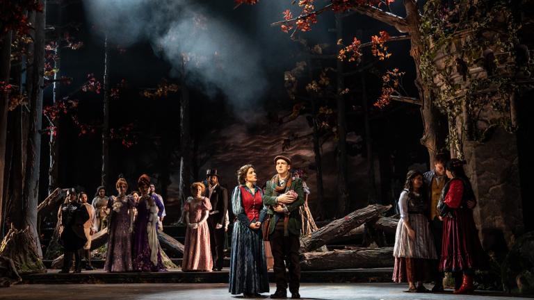 Sarah Bockel (center, left) plays the Baker’s Wife and Stephen Schellhardt is the Baker in Paramount Theatre’s “Into the Woods.” (Photographed by Rich Hein under the name Liz Lauren)