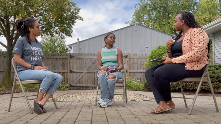 Remember Him Remember Her founder Paris Jackson, center, speaks with Nave Wellness Center therapists Alisha Lewis, left, and Alaina Harris, right, during a grief support group session on Aug. 17, 2024. (Courtesy of Raven Fisher)