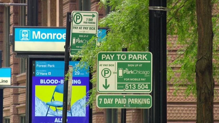Chicago parking meter signs are pictured on Sept. 28, 2026. (WTTW News)