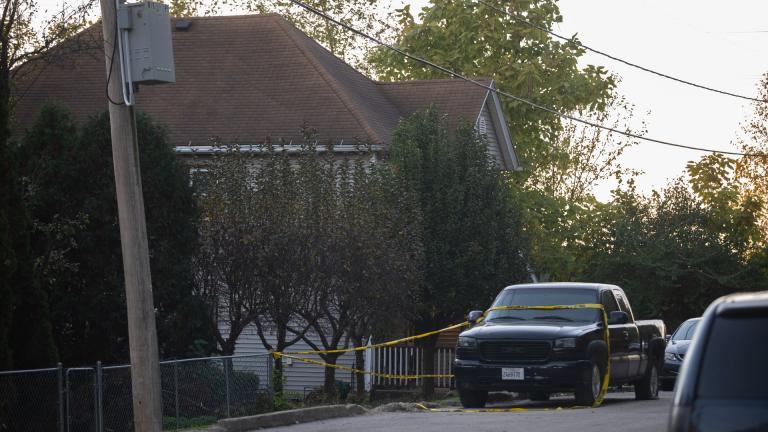 Police tape blocks off access to a fatal shooting at a house early Sunday, Oct. 31, 2021 in Joliet, Ill. Police were seeking tips from the public in finding two suspected shooters who fled from the scene and were also seeking witnesses or anyone who may have video or photographs from the party. (Anthony Vazquez / Chicago Sun-Times via AP) Police tape blocks off access to a fatal shooting at a house early Sunday, Oct. 31, 2021 in Joliet, Ill. Police were seeking tips from the public in finding two suspected shooters who fled from the scene and were also seeking witnesses or anyone who may have video or photographs from the party. (Anthony Vazquez / Chicago Sun-Times via AP)