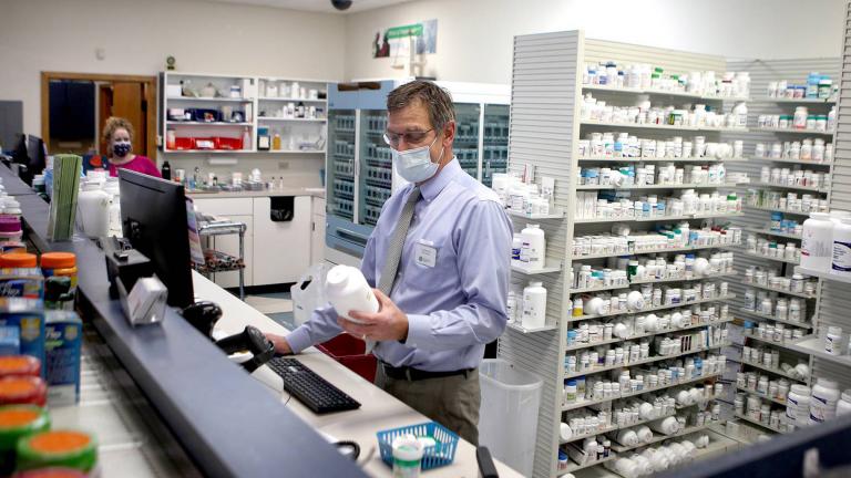 Pharmacist Tim Riley is one of more than a million workers who have kept showing up to work in person to keep the economy going. (Sandy Bressner / Shaw Local)