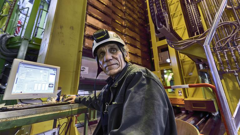 In this 2018 photo made available by CERN, Nikolai Bondar works on the LHCb Muon system at the European Organization for Nuclear Research Large Hadron Collider facility outside of Geneva. (Maximilien Brice, Julien Marius Ordan / CERN via AP)