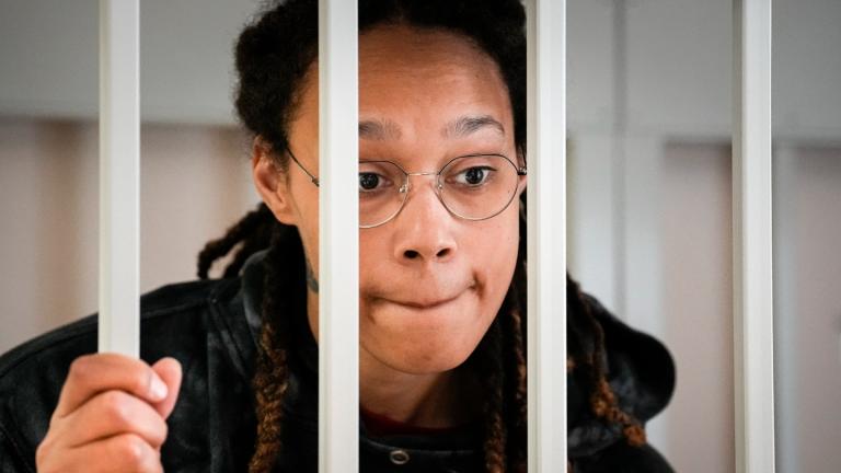 WNBA star and two-time Olympic gold medalist Brittney Griner speaks to her lawyers standing in a cage at a court room prior to a hearing, in Khimki just outside Moscow, Russia, Tuesday, July 26, 2022. (AP Photo / Alexander Zemlianichenko, Pool)