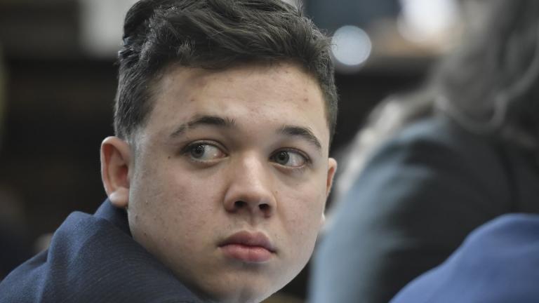 Kyle Rittenhouse looks back as Susan Hughes, the great aunt of Anthony Huber, enters the courtroom during his trial at the Kenosha County Courthouse in Kenosha, Wis., on Friday, Nov. 5, 2021. Anthony Huber was one of two men who Rittenhouse killed on Aug. 25, 2020. (Sean Krajacic/The Kenosha News via AP, Pool)