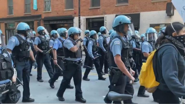 Chicago police officers monitor a crowd of protesters following the death of George Floyd. (WTTW News)