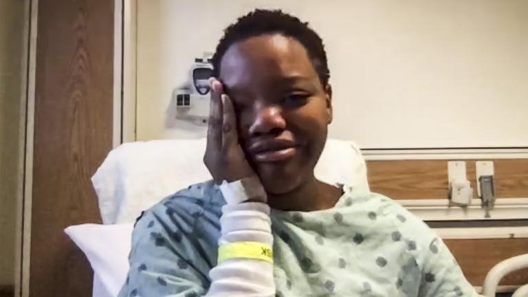 In this image taken from video, Tafara Williams speaking to reporters from her hospital bed during a Zoom meeting Tuesday, Oct. 27, 2020 in Libertyville, Ill. (Zoom / Chicago Sun-Times via AP)
