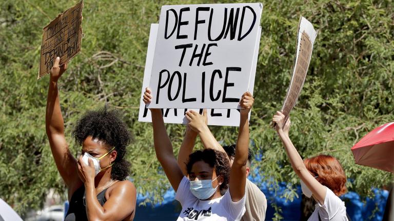 FILE - In this June 3, 2020, file photo, protesters rally in Phoenix, demanding the Phoenix City Council defund the Phoenix Police Department, following the death of George Floyd. (AP Photo / Matt York, File)