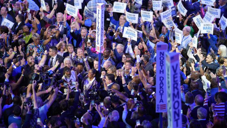 Gov. J.B. Pritzker surrounded by the Illinois delegation during the roll call vote on Aug. 20, 2024. (Emily Soto / WTTW News)