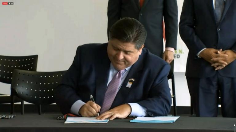 Gov. J.B. Pritzker signs into law two new bills advancing the rights of the LGBTQ+ community in Illinois on July 27, 2021. (WTTW News via Governor’s Office)