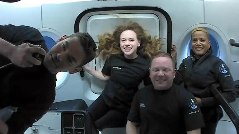 This photo provided by SpaceX shows the passengers of Inspiration4 in the Dragon capsule on their first day in space. They are, from left, Jared Isaacman, Hayley Arceneaux, Chris Sembroski and Sian Proctor. (SpaceX via AP)