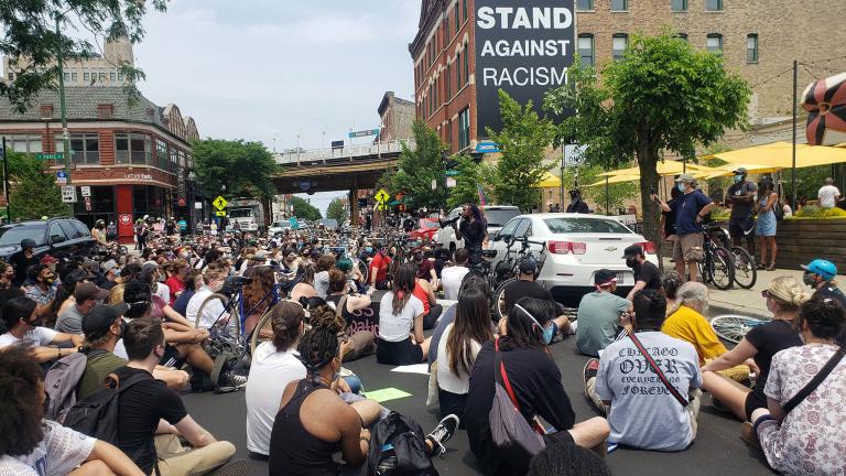 A crowd gathers on Damen Avenue in Wicker Park on Sunday, June 21, 2020. (Amanda Vinicky / WTTW News)