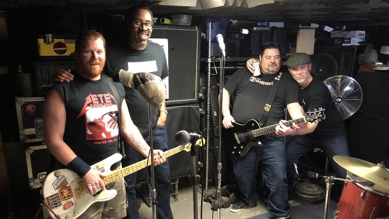 The Bollweevils pose after a rehearsal in a Northwest Side basement. From left: Pete Mittler, Daryl Wilson, Ken Fitzner, Pete Mumford. (Jay Shefsky / Chicago Tonight)