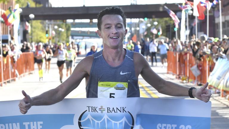 Tyler Pence of Springfield, Ill., finishes first in the TBK Bank Quad Cities Marathon on Sunday, Sept. 26, 2021, in Moline, Ill. (Gary L. Krambeck / Quad City Times via AP)