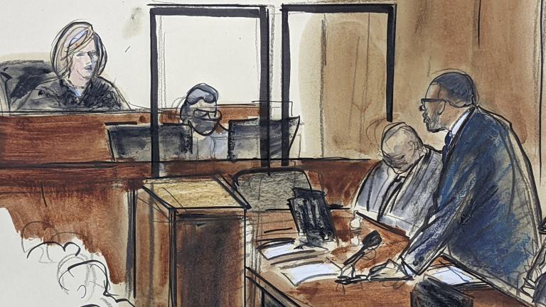 In this illustration drawn from a video feed, R. Kelly, right, stands and responds to Judge Ann Donnelly’s question whether or not he has decided to take the stand in his own defense, Wednesday, Sept. 22, 2021, in New York. (AP Photo / Elizabeth Williams)