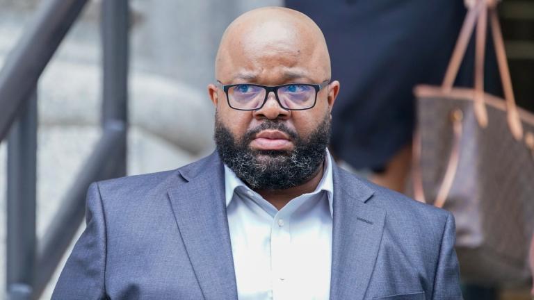 R. Kelly’s manager Donnell Russell leaves federal court, Wednesday, July 20, 2022, in New York. Russell was sentenced Monday, Dec. 19, to a year in federal prison for calling in a shooting threat that shut down a screening of a documentary. (AP Photo / Mary Altaffer, File)