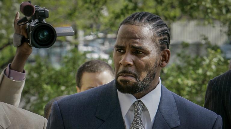 This photo from Friday May 9, 2008, shows R. Kelly arriving for the first day of jury selection in his child pornography trial at the Cook County Criminal Courthouse in Chicago. (AP Photo / Charles Rex Arbogast, File)