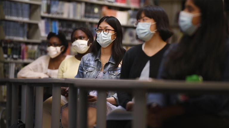 In this Monday, May 10, 2021 photo, Senior Annie Chen, center, listens with classmates as Connecticut Attorney General William Tong speaks for Asian Pacific American Heritage Month at Farmington High School in Farmington, Conn. (AP Photo / Jessica Hill) 