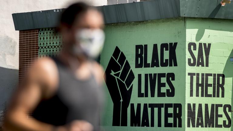 In this July 13, 2020, file photo, a black lives matter mural is visible in the Shaw neighborhood in Washington. (AP Photo / Andrew Harnik, File)