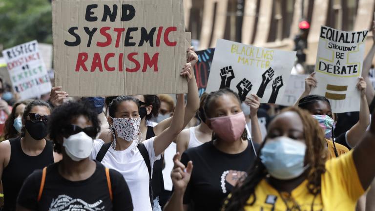 In this June 19, 2020, file photo, people demonstrate in Chicago, to mark Juneteenth. (AP Photo / Nam Y. Huh, File)