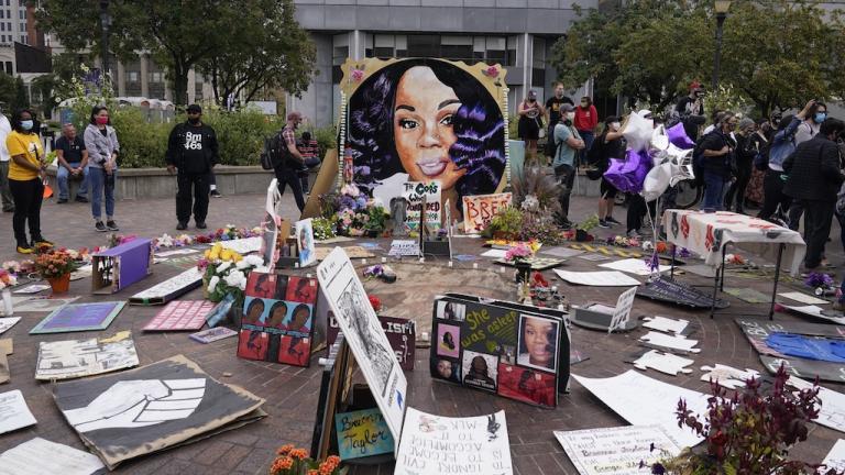 In this Wednesday, Sept. 23, 2020, file photo, people gather in Jefferson Square in Louisville, awaiting word on charges against police officers in the death of Breonna Taylor. (AP Photo/Darron Cummings, File)