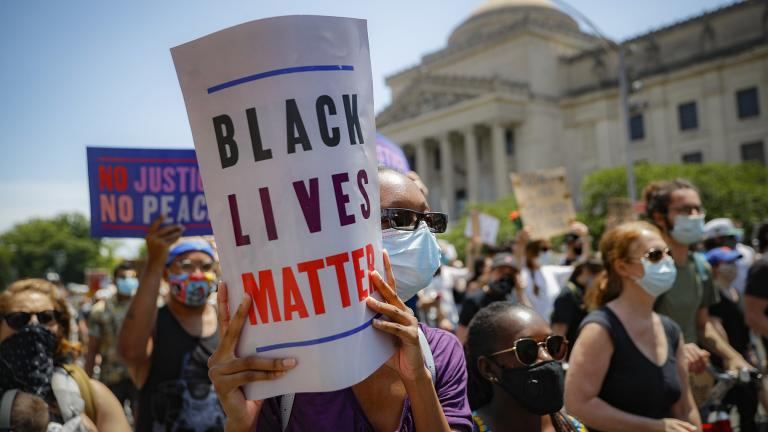 In this June 19, 2020, file photo, protesters wear protective masks as they march after a Juneteenth rally outside the Brooklyn Museum, in the Brooklyn borough of New York. (AP Photo / John Minchillo)