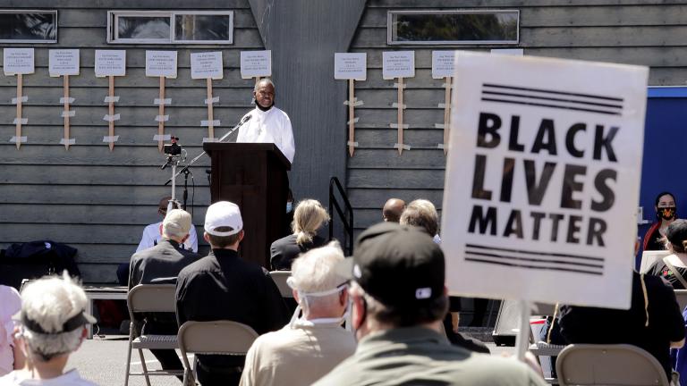 Deacon Joseph Conner speaks at an outdoor prayer vigil for racial justice at Immaculate Conception Catholic Church Sunday, July 19, 2020, in Seattle. (AP Photo / Elaine Thompson)