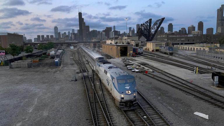 An Amtrak passenger train departs Chicago in the early evening headed south Wednesday, Sept. 14, 2022, in Chicago. (AP Photo/Charles Rex Arbogast, File)