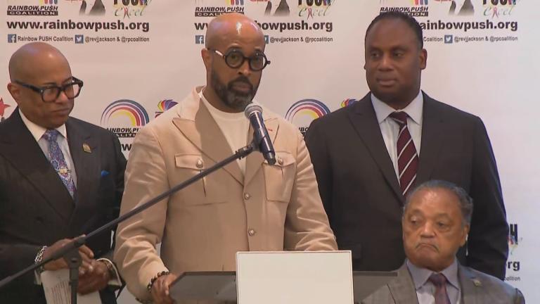 The Rev. Frederick Haynes III (at podium) and the Rev. Jesse Jackson (seated, right) at a news conference for Rainbow PUSH on July 18, 2023. (WTTW News)