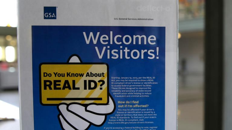 In this photo taken April 6, 2016, a sign at the federal courthouse in Tacoma, Wash., is shown to inform visitors of the federal government's REAL ID act. (AP Photo / Ted S. Warren, file)
