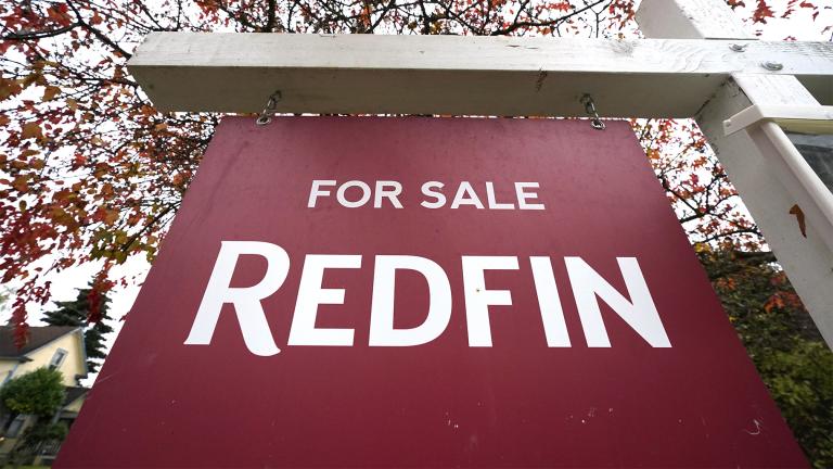 A Redfin “for sale” sign stands in front of a house on Oct. 28, 2020, in Seattle. (AP Photo / Elaine Thompson, File)