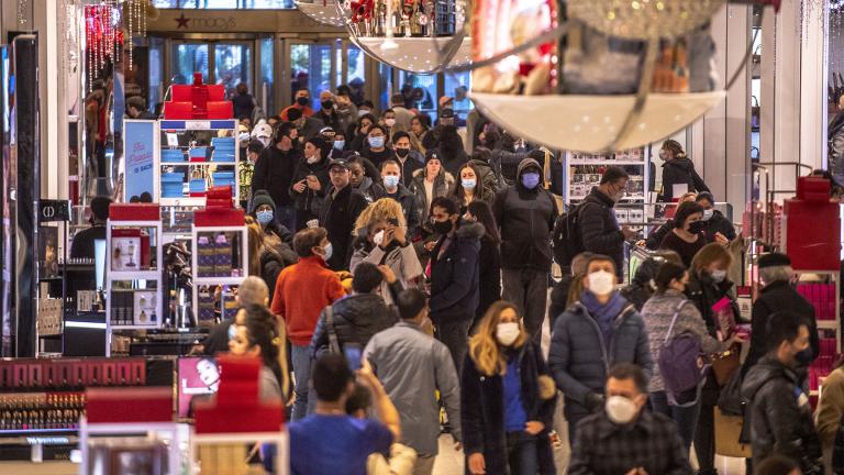 People shop in Macy's on Nov. 26, 2021, in New York. (AP Photo / Brittainy Newman, File)