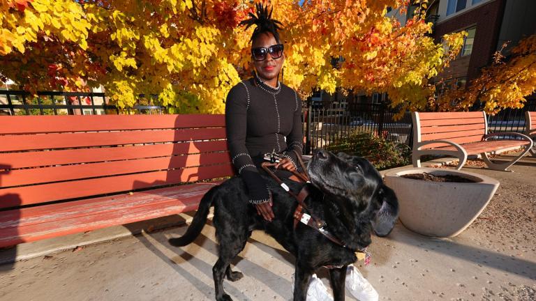 Amber Sherrard and her 10-year-old black Labrador Della are shown outside their home Friday, Nov. 15, 2024, in east Denver. (David Zalubowski / AP Photo)