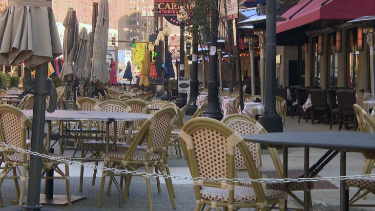 Outdoor dining tables line Rush Street in Chicago as state-imposed restrictions suspending indoor dining and drinking take effect Friday, Oct. 30, 2020. (WTTW News)