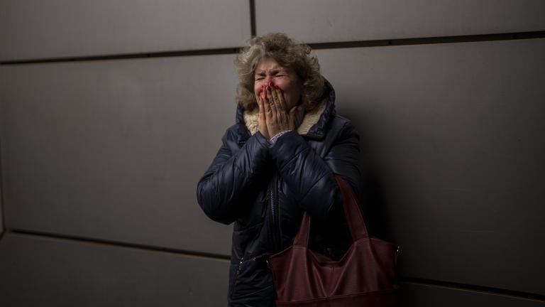 Natalia, 57, cries as she says goodbye to her daughter and grandson on a train to Lviv at the Kyiv station, Ukraine, Thursday, March 3. 2022. (AP Photo/Emilio Morenatti)