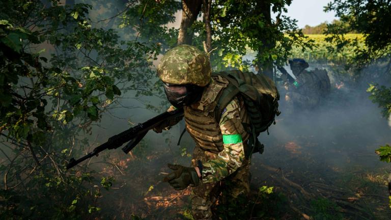 A Ukrainian National Guard serviceman of 3rd brigade «Spartan» runs through a tree line during a training not far from the frontline on Pokrovsk direction, Ukraine, on Friday, August 8, 2025. (AP Photo / Evgeniy Maloletka)