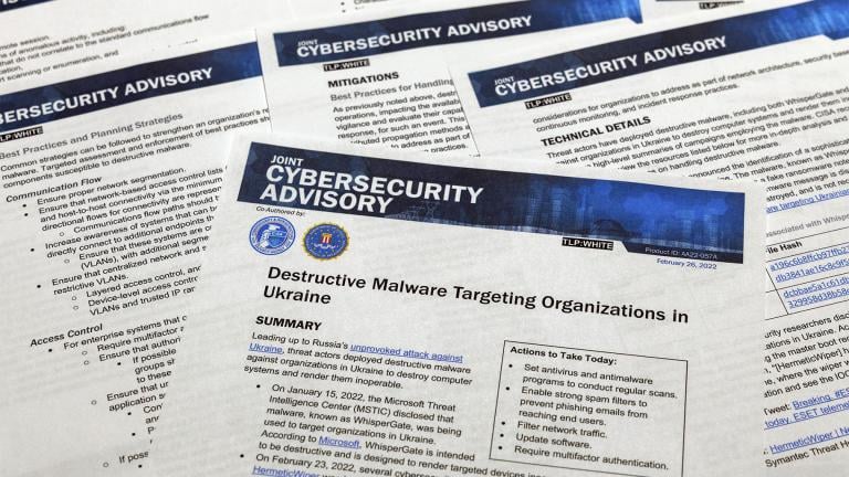 A Joint Cybersecurity Advisory published by the Cybersecurity & Infrastructure Security Agency about destructive malware that is targeting organizations in Ukraine is photographed Monday, Feb. 28, 2022. (AP Photo / Jon Elswick)