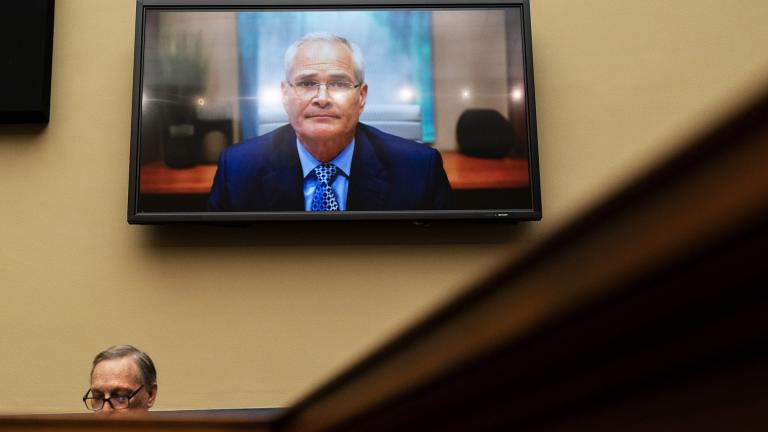 Darren Woods, CEO of ExxonMobil, testifies via video conference during a House Committee on Oversight and Reform hearing on the role of fossil fuel companies in climate change, Oct. 28, 2021, with Rep. Ralph Norman, R-S.C., at left, on Capitol Hill in Washington. (AP Photo / Jacquelyn Martin, File)