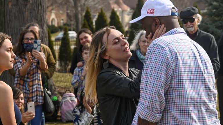 Newlyweds Maria and David during their ceremony at a home, Saturday, March 5, 2022, in Oak Park, Ill. Maria, whom is from Ukraine, is headed back there to volunteer, a few days after she was married. (AP Photo / Matt Marton)