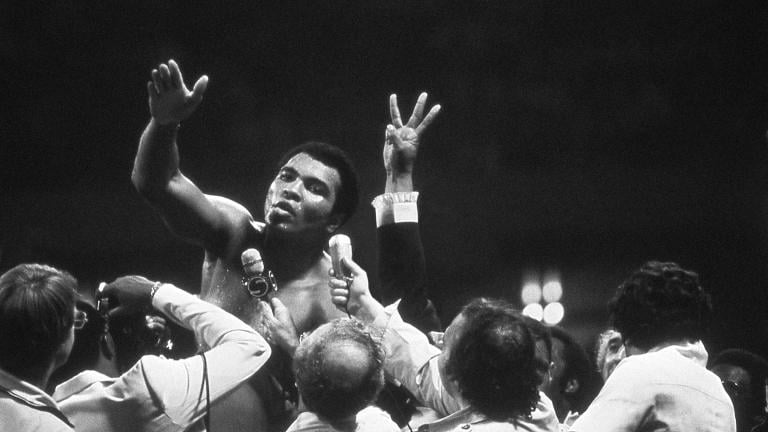 Muhammad Ali talks with the press after winning back the Heavyweight Championship for an unprecedented third time by beating Leon Spinks at the Super Dome in New Orleans, LA. Sept. 15, 1978. (Courtesy of Michael Gaffney)