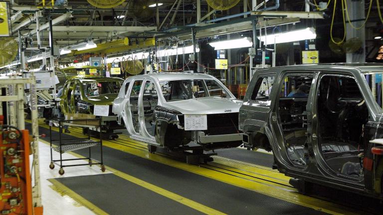 Jeep Compass and Patriot vehicles move down an assembly line during a tour of the Chrysler Belvidere Assembly plant in Belvidere, Illinois, in 2012. (Reuters) 
