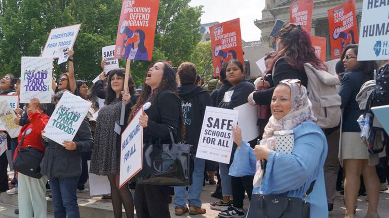 Immigrant rights advocates demonstrate outside the Illinois Statehouse in Springfield in May 2025, urging passage of legislation to guarantee all children the right to a free public education regardless of their immigration or citizenship status. (Peter Hancock / Capitol News Illinois)