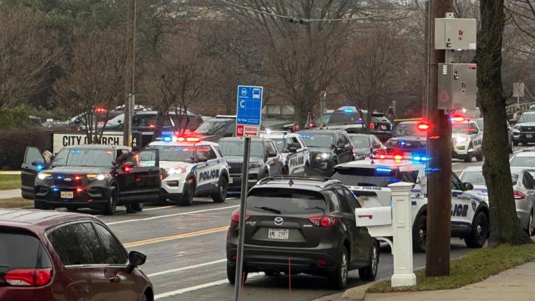 Emergency vehicles are parked outside the Abundant Life Christian School in Madison, Wis., where multiple injuries were reported following a shooting, Monday, Dec. 16, 2024. (Scott Bauer / AP Photo)