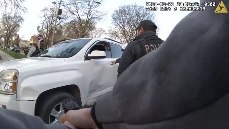 Chicago police officers surround an SUV driven by Dexter Reed moments before shots are fired on March 21, 2024. (Civilian Office of Police Accountability)