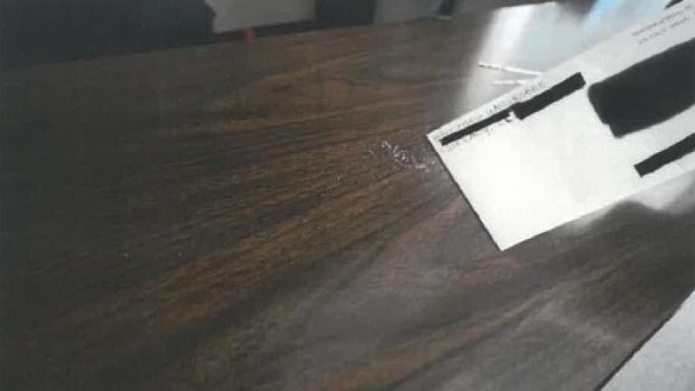 A letter allegedly containing a suspicious substance recovered by FBI investigators on Oct. 21, 2026. (U.S. Department of Justice)